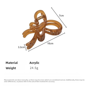 Detail view of amber brown acrylic butterfly hair claw clip with 24.5g weight and 10cm size