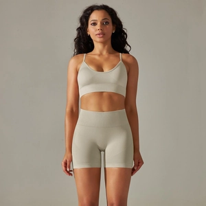 Detail of ribbed knit yoga set showing V-neck sports bra and high-waist seamless shorts