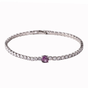 Detail of silver tennis bracelet with cubic zirconia and a central round purple gem
