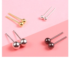 Macro view of S925 sterling silver ball stud earrings in gold, silver and gunmetal finish