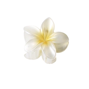 Elegant white plumeria flower hair claw clip with yellow gradient and pearlescent finish