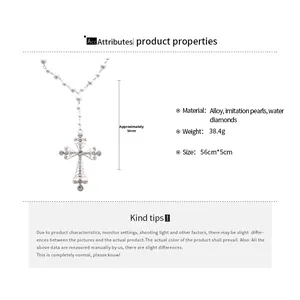 Detail showing faux pearl cross necklace with rhinestone inlay and dimensions of 56cm