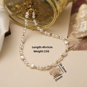 Detailed view of pearl necklace with star pendant and specifications on vintage box