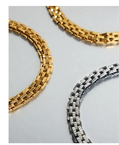 Detailed top view of gold and silver minimalist industrial style twill mesh metal bracelets