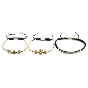 Detailed view of three-piece adjustable gold crown and zircon braided bracelets for men
