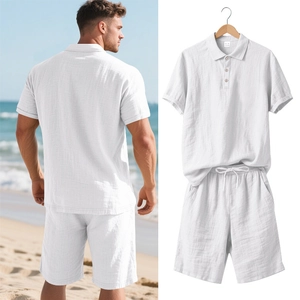 Detail of white linen summer polo set with drawstring shorts on hanger and beach view