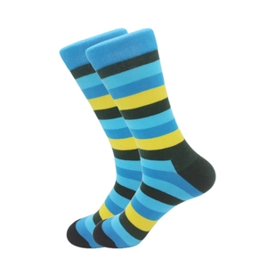 Detail view of striped crew socks with blue, yellow and green knit patterns for men