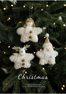 Close-up of plush star ornaments with bells on a Christmas tree with warm LED lights