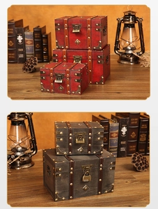 Detail of vintage wooden treasure chests with metal latches and rustic leather straps