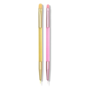 Pink and gold dual-ended nail art brushes with flat and liner tips on white background