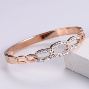 Detailed view of rose gold geometric bracelet featuring pave-set sparkling crystals