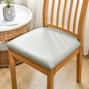 Detail of waterproof grey PU leather chair seat cover on a wooden dining chair