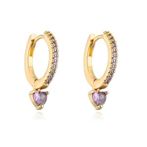 Macro shot of 18K gold-plated huggie hoop earrings with purple heart crystal pendants