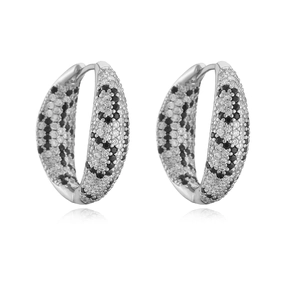 Close-up of hoop earrings with silver plating and micro-pave black and white zircons