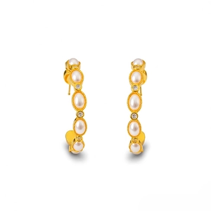 Vintage gold plated C-shaped earrings with tiger eye pearls and sparkling crystal stones