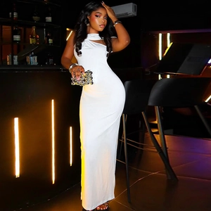 Detailed shot of the white halter neck dress with elegant pleats and slim fit silhouette