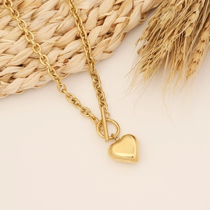 Handmade gold heart pendant necklace with T-bar clasp on stainless steel cable chain