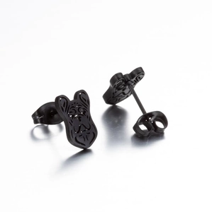 Detail of minimalist black metal stud earrings featuring hollow French Bulldog design