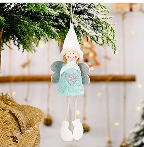 Detail view of plush angel ornament with mint faux fur and sparkling silver heart