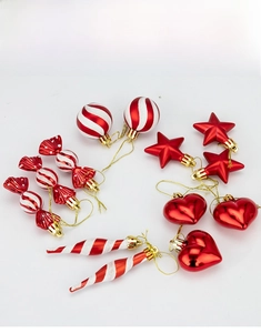Detail of red and white Christmas ornaments including candy, stars and heart shapes