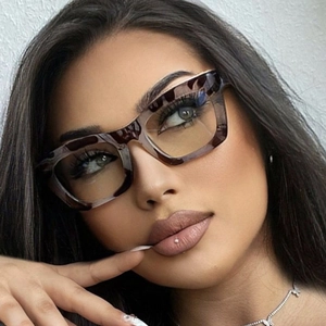 Close-up of tortoise shell square glasses frames on a model for high-fashion detail
