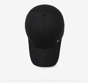 Top view of a black baseball cap with premium twill cotton texture and metal logo detail