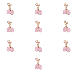 Macro detail of eleven pink enamel tennis racket charms for DIY jewelry making accessories