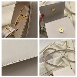 Detail view of cream PU leather bag featuring gold hardware and magnetic snap closure