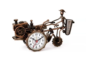 Macro shot of bronze vintage motorcycle tractor clock featuring white quartz watch dial