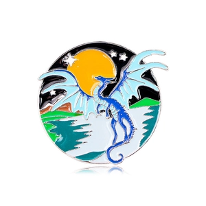 Retro round flying dragon enamel brooch with blue wings and a yellow moon background