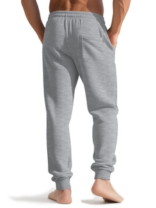 Rear view of men's grey waffle knit joggers showing breathable fabric and elastic waist