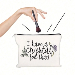 Detailed view of white canvas cosmetic bag with I have a crystal for that print