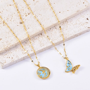 Set collana farfalla e stella-luna dorata con smalto blu e cristalli lucidi