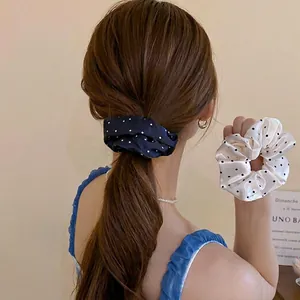 Satin polka dot scrunchie set shown on high ponytail with a vintage aesthetic look