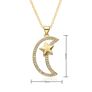 Detail shot of gold sun and moon pendant with white zircon showing 26mm x 16mm dimensions