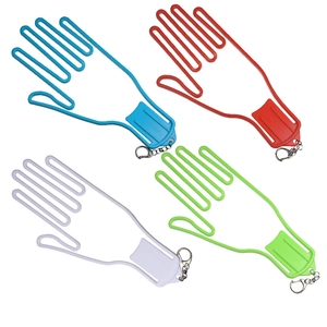 Detail view of colorful golf glove stretcher hangers in blue, red, white, and green colors