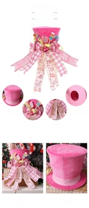 Detail of pink gingerbread man Christmas tree topper with velvet fabric and large bow