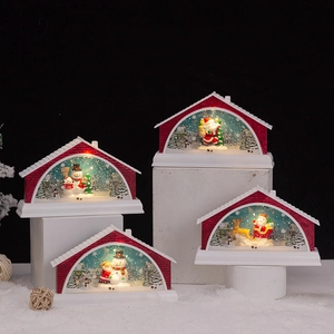 Lighted Christmas snow globe house music box with Santa and snowman figurines