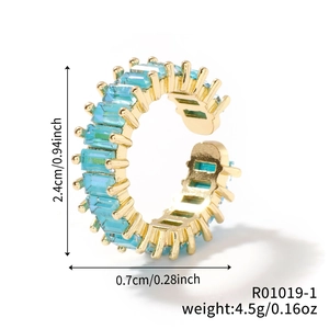 Detail showing a golden gear ring with rectangular turquoise stone and size dimensions