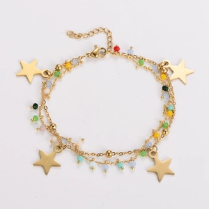 Detail of double-layer gold star charm bracelet with colorful translucent beads