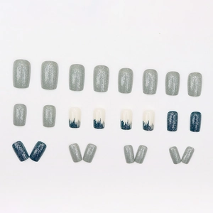 Medium square blue and grey press-on nails with glitter and forest silhouette patterns