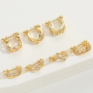 Set of seven minimalist gold U-shaped nose studs with sparkling cubic zirconia crystals