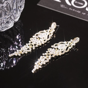Luxurious gold teardrop tassel earrings with sparkling rhinestones for elegant women