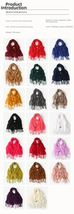 Detail showing 20 color variations of tassel scarves with fine cotton polyester texture
