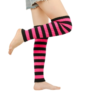 Close-up of pink and black striped knit leg warmers with high elasticity and ribbed cuffs