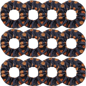Set of twelve black basketball print fabric scrunchies arranged in a grid on white background