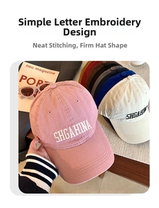 Detail of embroidered SHGAHINA letters on soft cotton baseball caps in various colors
