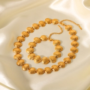 18K gold plated stainless steel shell necklace and bracelet set on champagne silk fabric