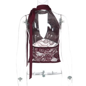 Macro detail of wine red lace stitching and deep V-neckline on the halter crop top