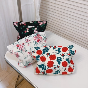 Three retro floral cotton cosmetic bags featuring different rose and tulip patterns.
